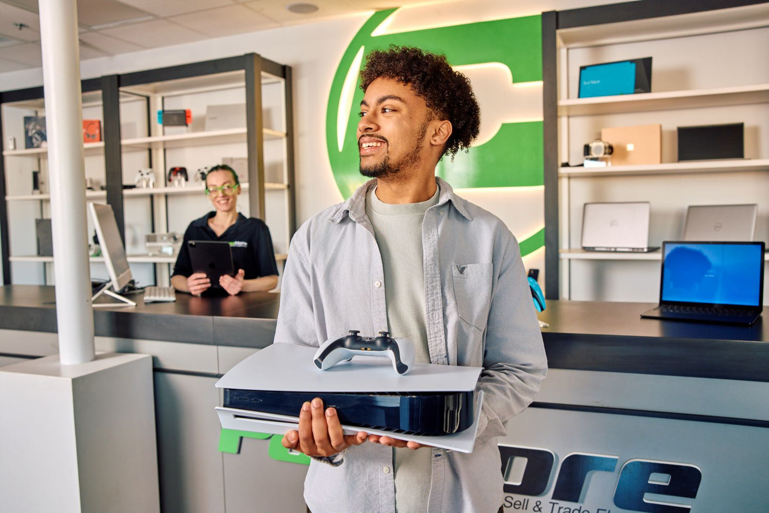 customer smiling after purchasing a gaming console
